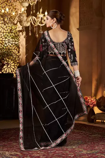 Black women embellished sequinned net saree