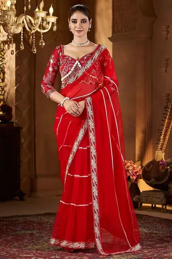 Red embellished embroidered sequinned net saree