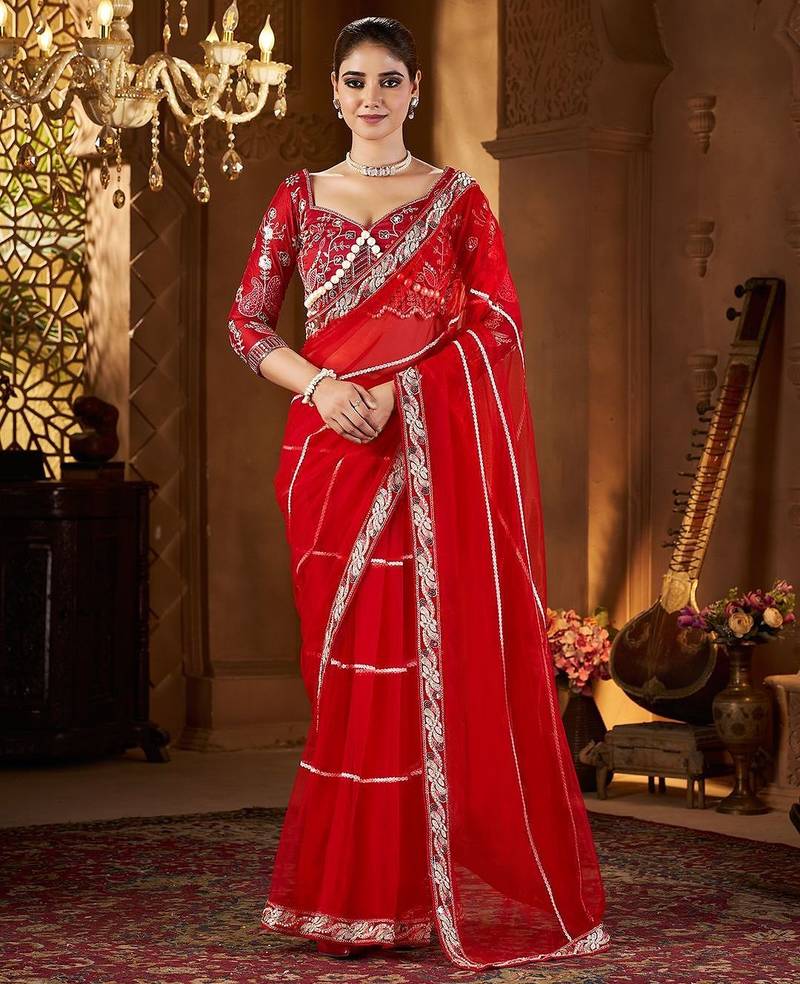 Red embellished embroidered sequinned net saree
