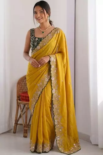 Yellow embellished embroidered pure georgette heavy work saree