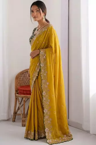 Yellow embellished embroidered pure georgette heavy work saree