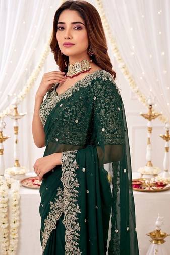 Green ethnic motifs embroidered poly georgette heavy work saree