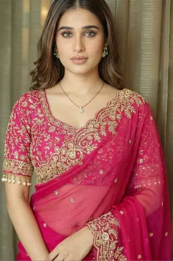 Pink ethnic motifs embroidered satin saree