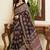 Brown ajrak block mirror work bandhani saree