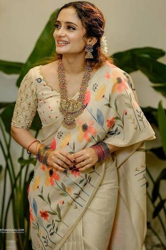 Cream floral printed tissue jamdani saree