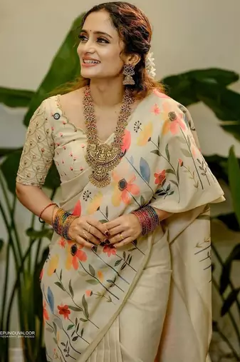 Cream floral printed tissue jamdani saree