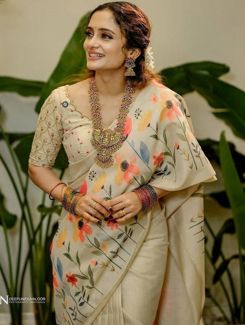 Cream floral printed tissue jamdani saree