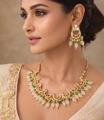 Gold plated kundan necklace set with green beads and white drop with chandbali earrings