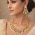 Gold plated kundan necklace set with green beads and white drop with chandbali earrings
