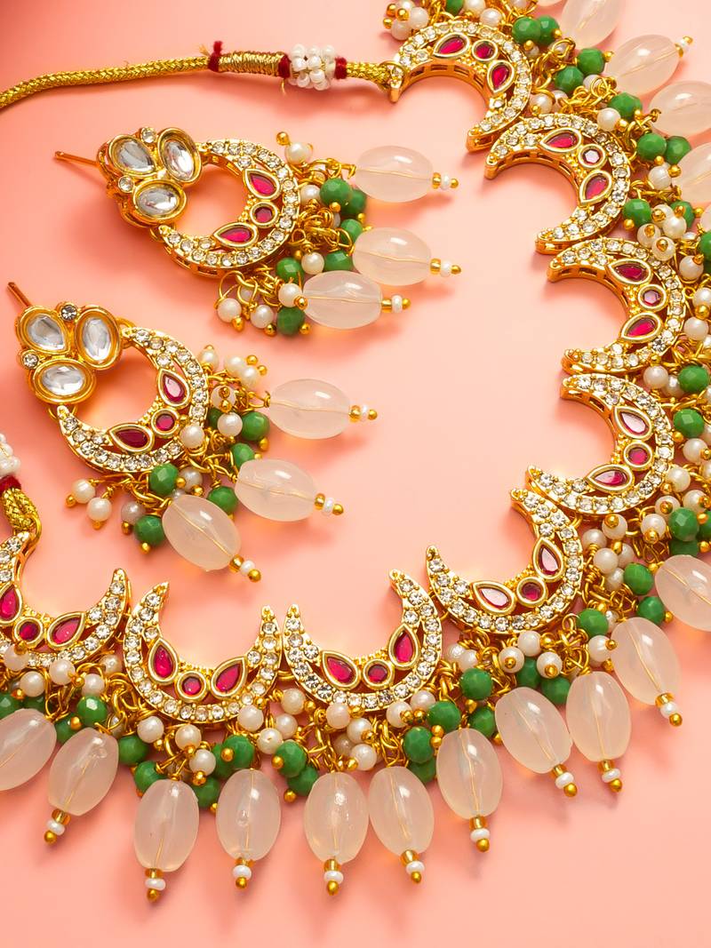Gold plated kundan necklace set with green beads and white drop with chandbali earrings