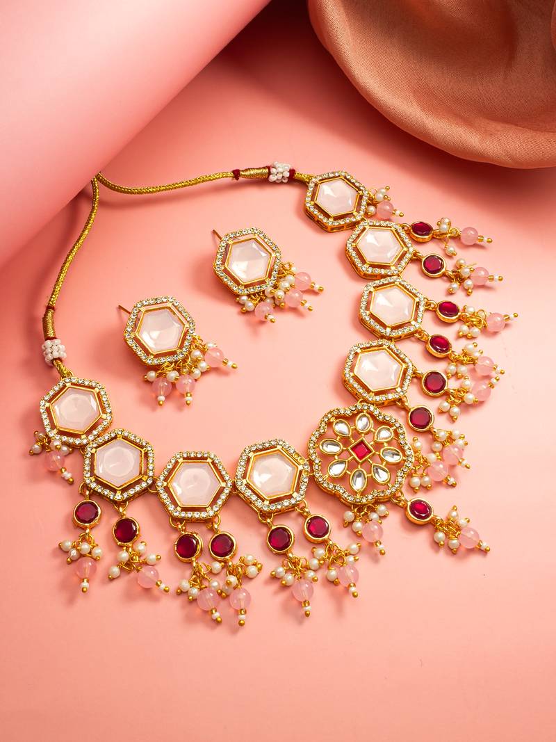Gold plated kundan necklace set with pink stones end earrings