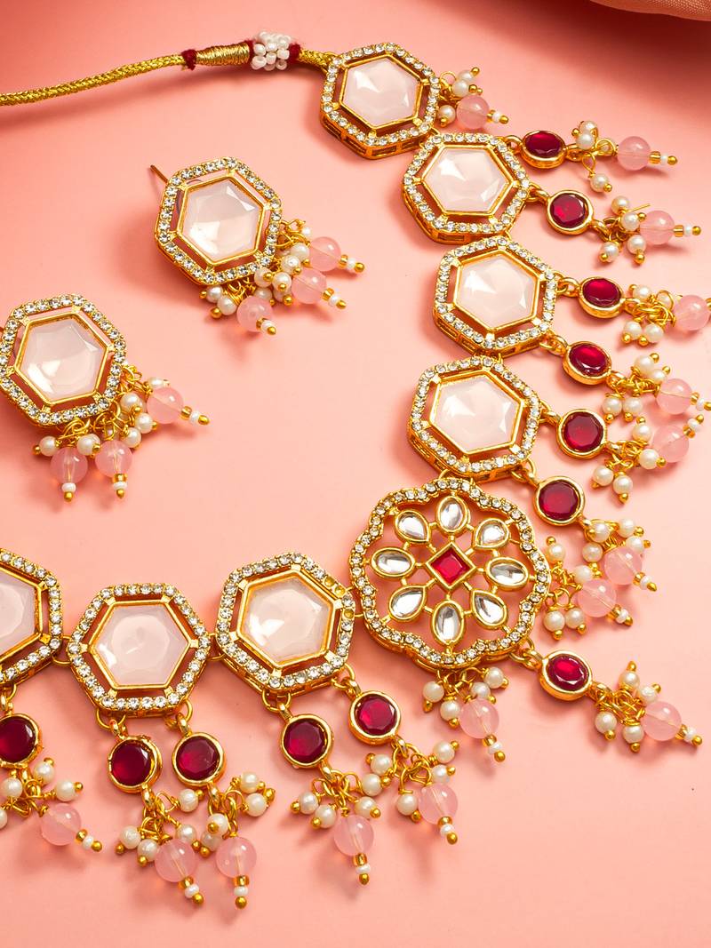 Gold plated kundan necklace set with pink stones end earrings