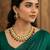 Gold plated kundan necklace set with green meenakari, red beads and crystal accents with earrings