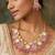 Gold plated choker necklace set with pink stones and pearl with earrings