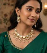 Gold-plated kundan choker necklace set with crystal stones and pearl drops and earrings