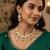 Gold-plated kundan choker necklace set with crystal stones and pearl drops and earrings