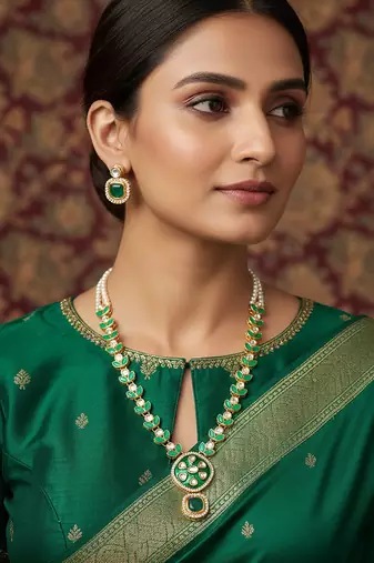 Gold-plated kundan necklace set with green meenakari pendant and pearl chain and earrings