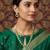Gold-plated kundan necklace set with green meenakari pendant and pearl chain and earrings