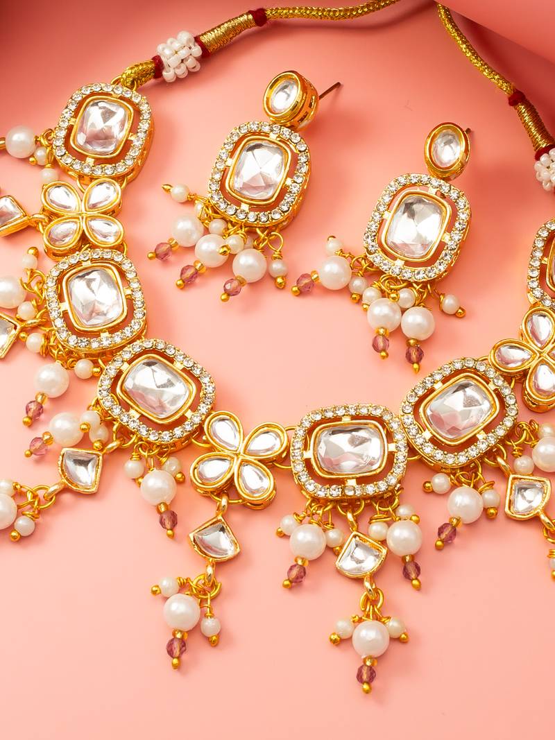 Gold-plated kundan choker necklace set with crystal stones and pearl drops and earrings