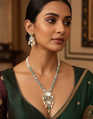 Silver-plated kundan necklace set with green stones and pearl drops 1