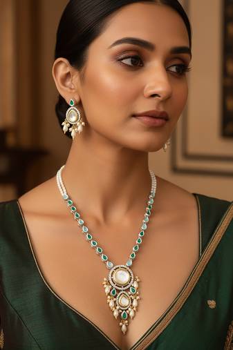 Silver-plated kundan necklace set with green stones and pearl drops