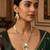 Silver-plated kundan necklace set with green stones and pearl drops