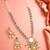 Silver-plated kundan necklace set with green stones and pearl drops