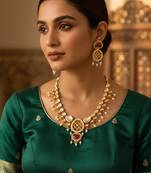Red kundan polki necklace set with meenakari accents and drop earrings