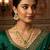 Green meenakari kundan double-layer choker necklace set with pearl drops and chandbali earrings