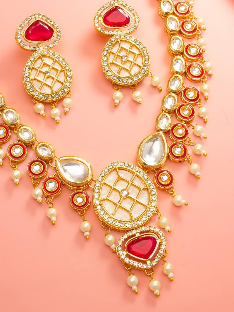 Red kundan polki necklace set with meenakari accents and drop earrings
