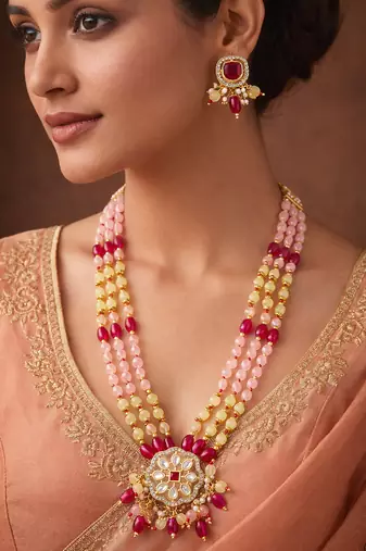 Pink and yellow beaded multi-strand kundan pendant necklace set with matching earrings