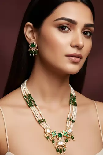 Gold plated long pearl necklace set with green stone pendant and earrings