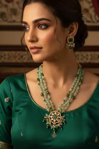 Gold plated kundan long necklace set with mint green beads and green stone earrings
