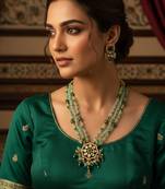 Gold plated kundan long necklace set with mint green beads and green stone earrings