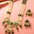 Gold plated long pearl necklace set with green stone pendant and earrings