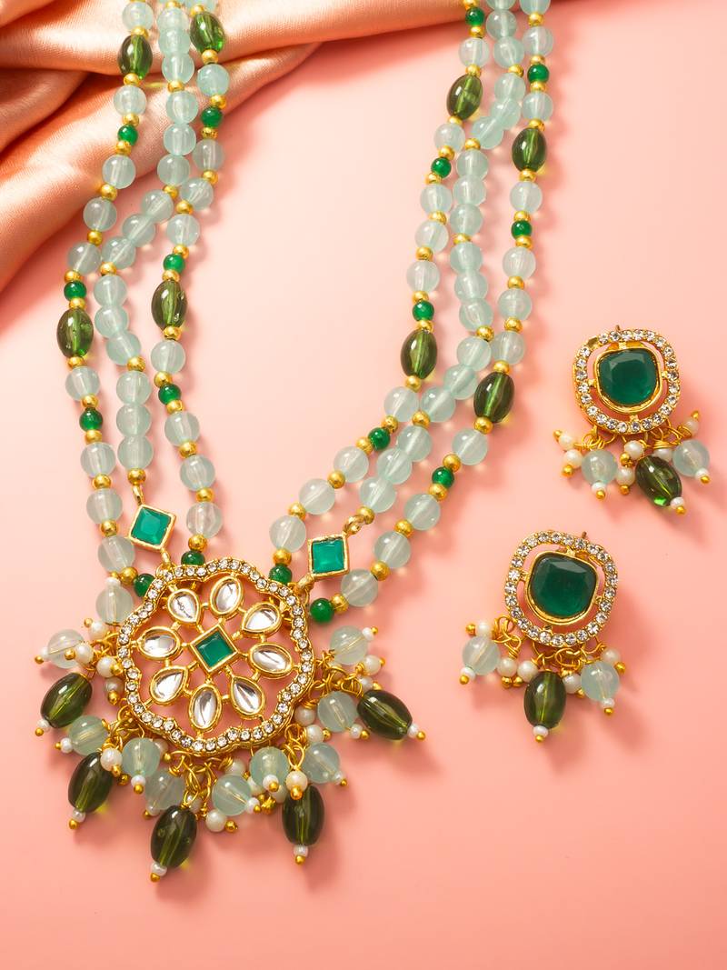 Gold plated kundan long necklace set with mint green beads and green stone earrings