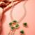 Gold plated pendant pearl necklace set with green stone and ad earrings