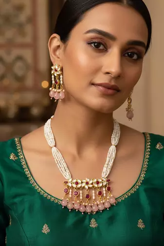 Gold plated multi strand pearl necklace with ruby red pendant