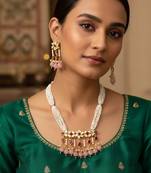 Gold plated multi strand pearl necklace with ruby red pendant