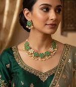 Gold plated green floral kundan necklace set with pearls