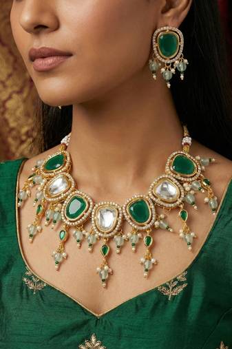 Gold plated green and white kundan statement necklace set