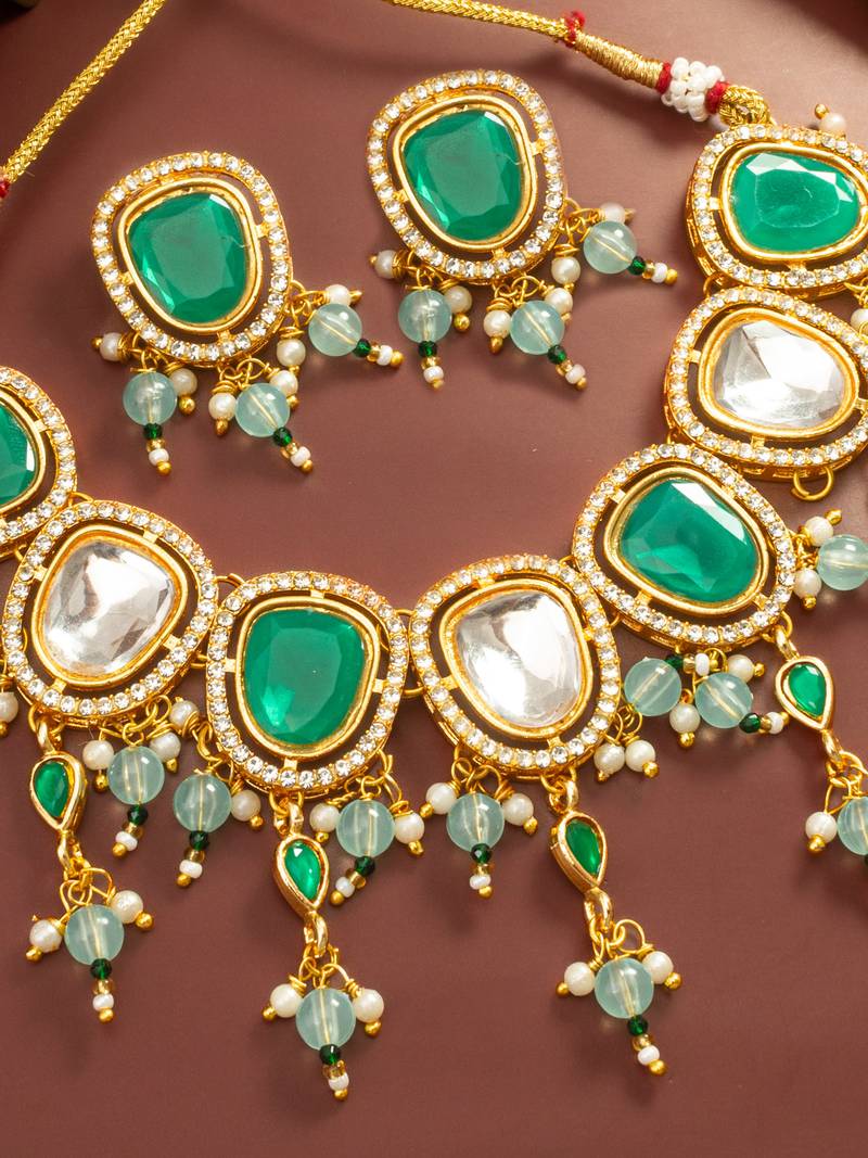 Gold plated green and white kundan statement necklace set