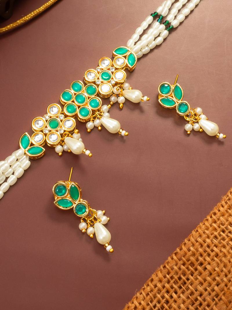 Gold plated multi strand pearl bead choker with green kundan pendant