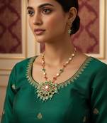 Gold plated kundan necklace set with green and pink stones and bead droplets