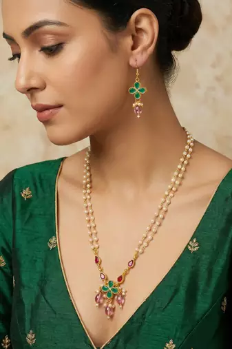 Gold plated double layered pearl necklace with floral accents