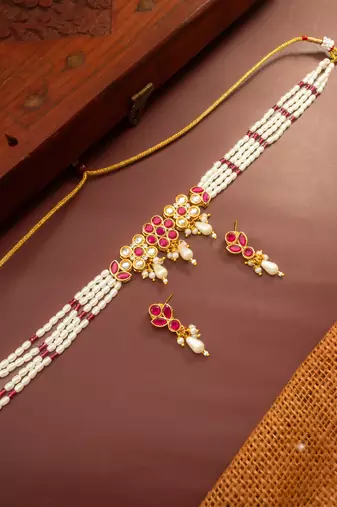 Gold plated multi-strand pearl necklace with red stone detail
