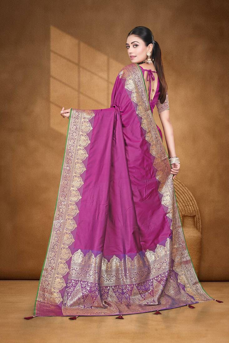 Banarasi magenta silk blend saree with golden zari work, border and tassels with blouse