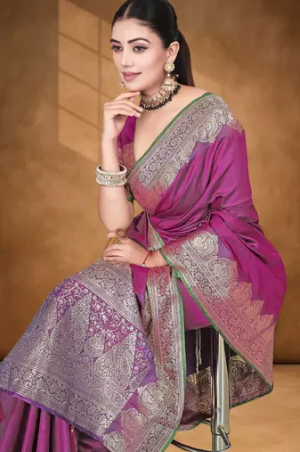 Banarasi magenta silk blend saree with golden zari work, border and tassels with blouse