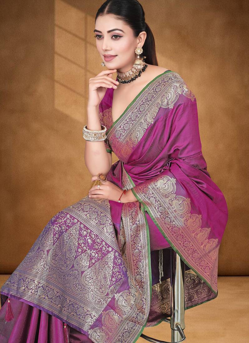 Banarasi magenta silk blend saree with golden zari work, border and tassels with blouse