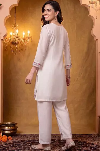 women floral embroidered regular thread work kurta with trousers